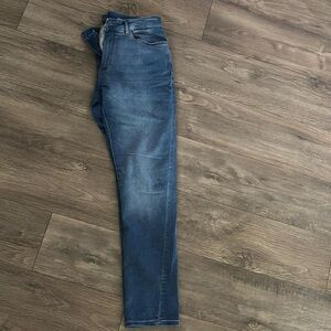 DL1961 mens jeans 34x34. Tapered and stretchy. Mid-wash color